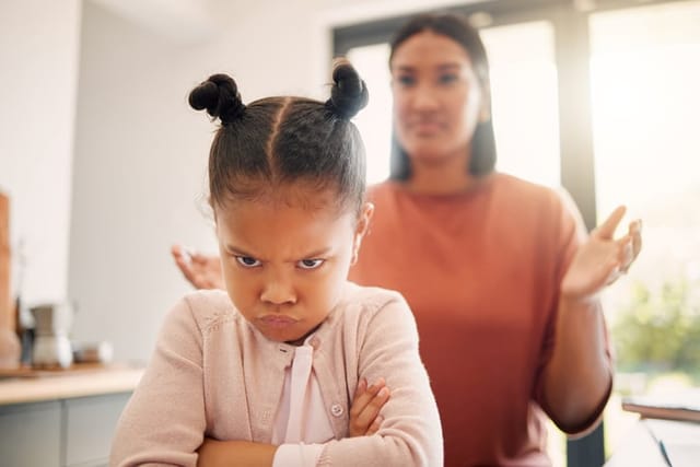 exasperated parent with upset child