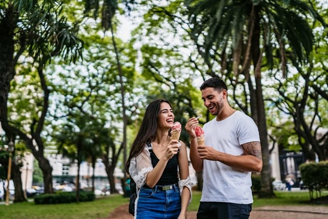 couple having ice cream in park