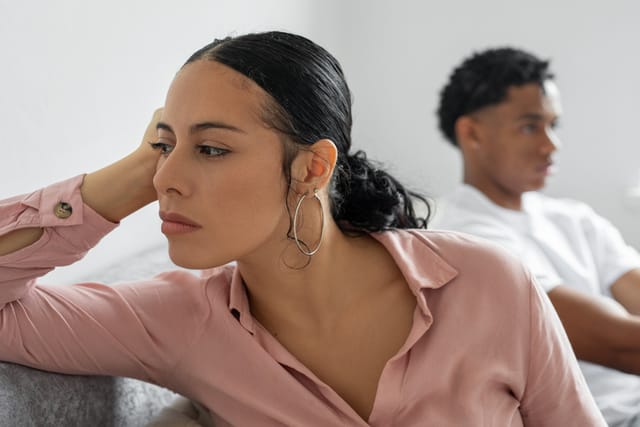 upset couple on couch after fight