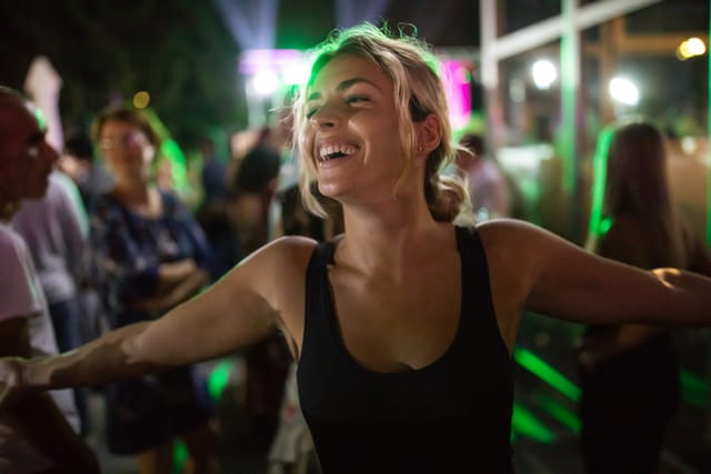 blonde woman partying at night