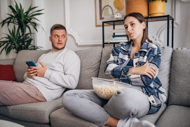 couple having argument on the couch