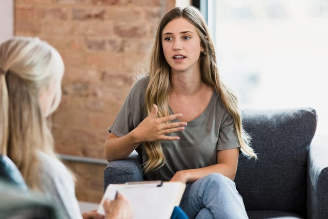 woman chatting with therapist