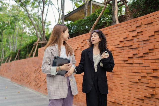 female friends chatting on walk