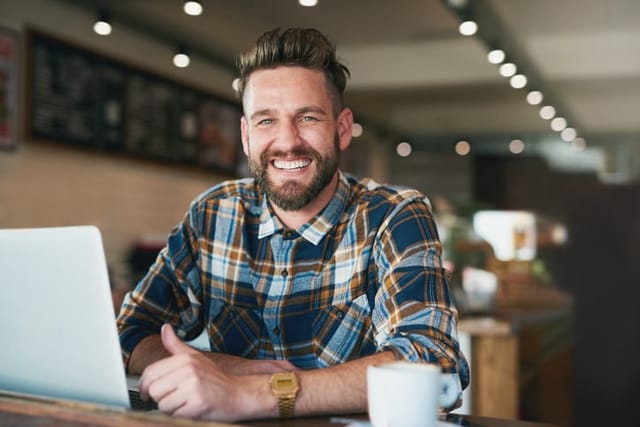 smiling guy at coffee shop