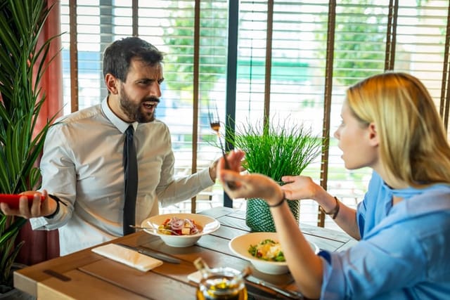 couple arguing at cafe