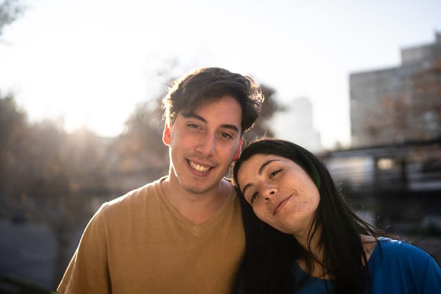 couple smiling out in sunshine