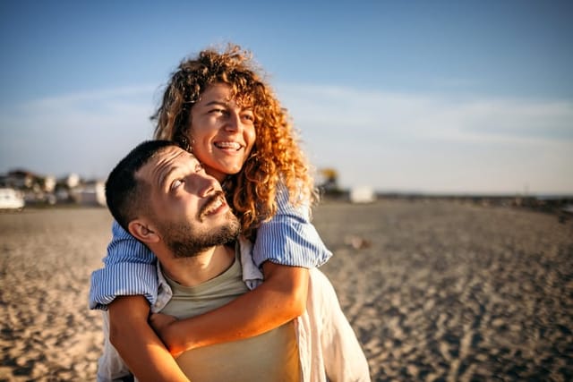 couple embracing on sunny beach