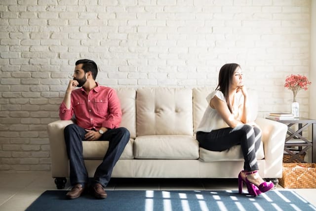 couple on couch not talking