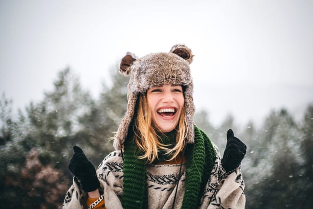 smiling woman outside in winter