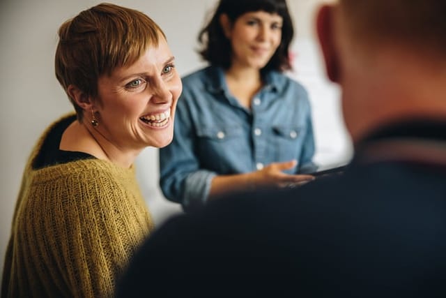 woman listening to a man speak