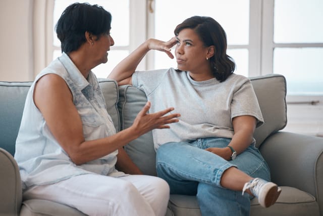 woman being lectured by her mother