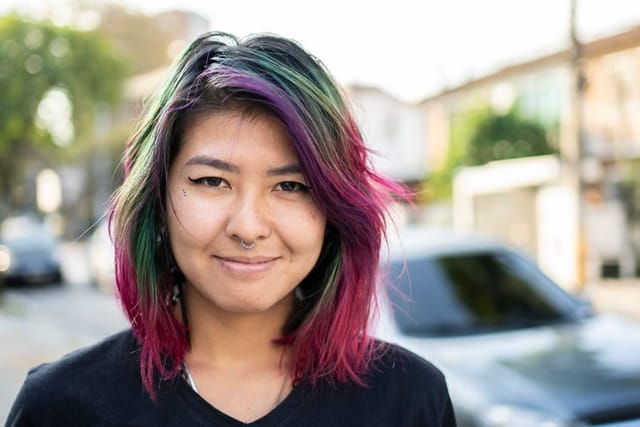 Portrait of Asian woman with dye hair in the street