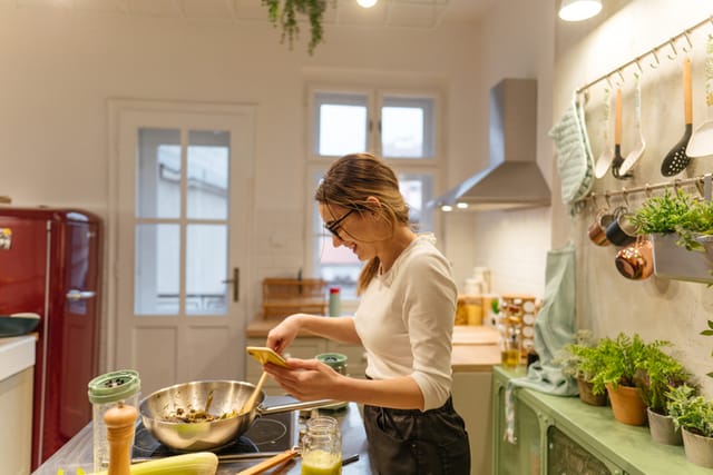 woman cooking lunch in kitchen