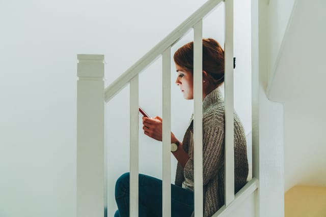 Woman feels worried because of cyberbullying attacks