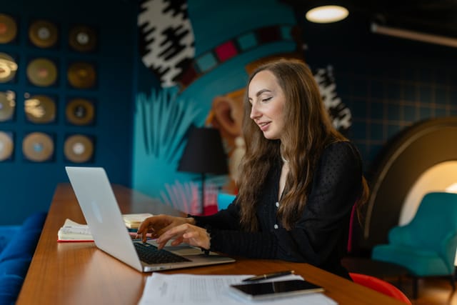 Young executive working on busines project on laptop