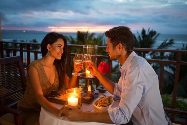 couple having candlelit dinner outdoors