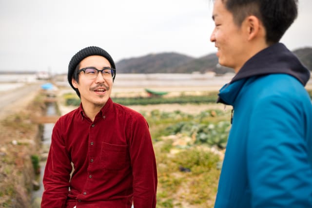two men chatting while on hike