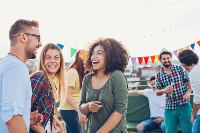 group of friends chatting at a party