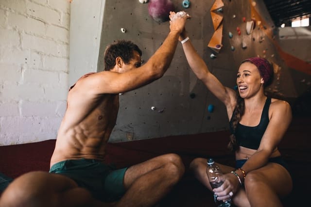 couple high fiving after tough workout