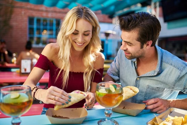 couple eating tacos on a date