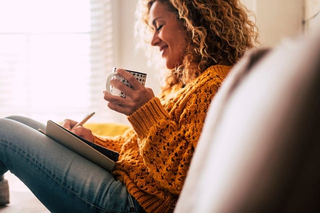 Woman happily alone at home.