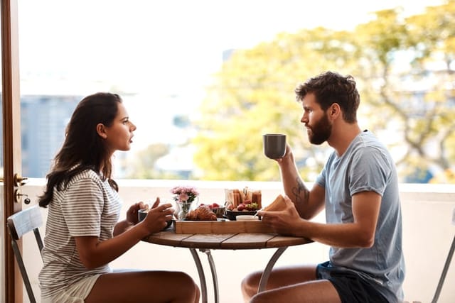 young couple having an argument at cafe