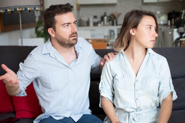 Young couple arguing at home needs couples therapy