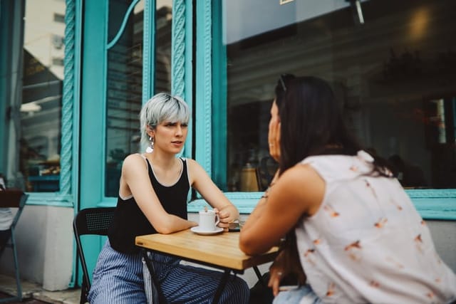 two female friends at outdoor cafe