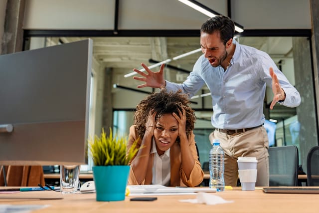 angry boss yelling at worker