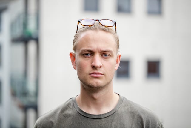 serious man with glasses on head