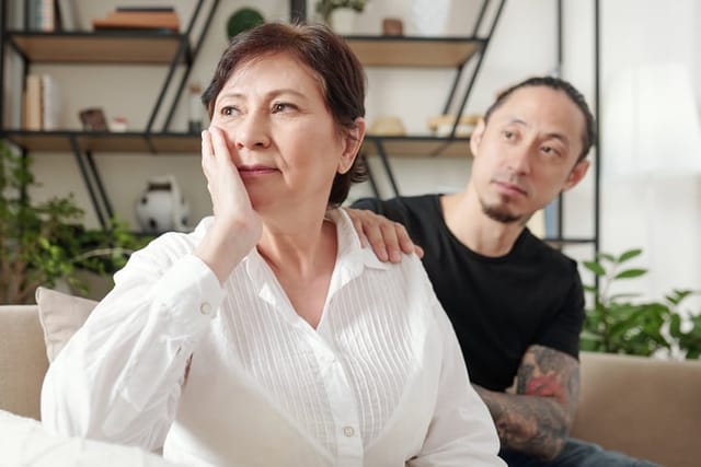 Sad man worried about his mother.