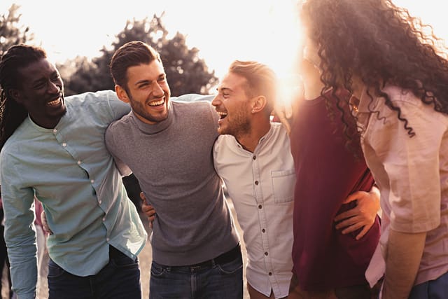 millennial guys laughing with each other