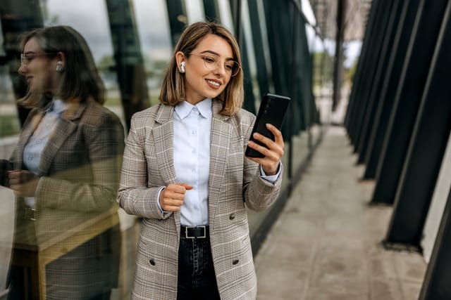 Businesswoman having video call outdoors.