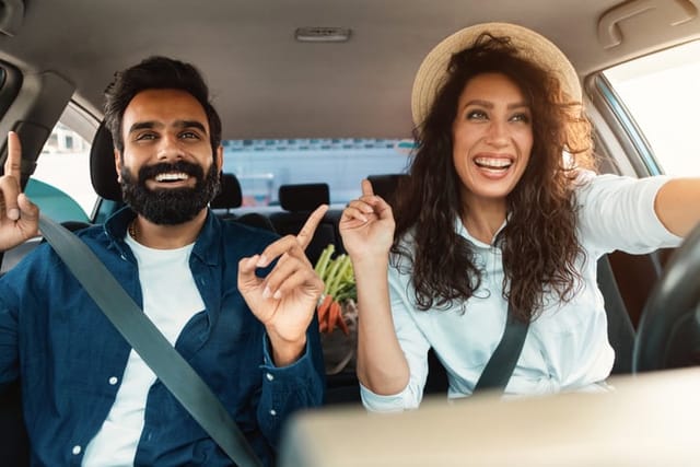 male and female friends going for a drive
