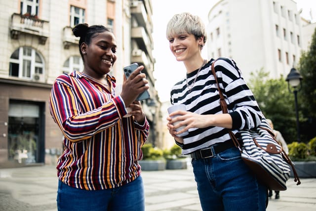 two friends having a chat on the street