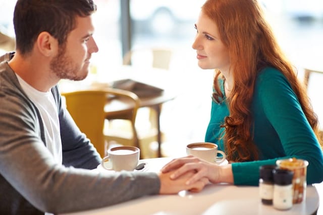 male and female friends talking in cafe