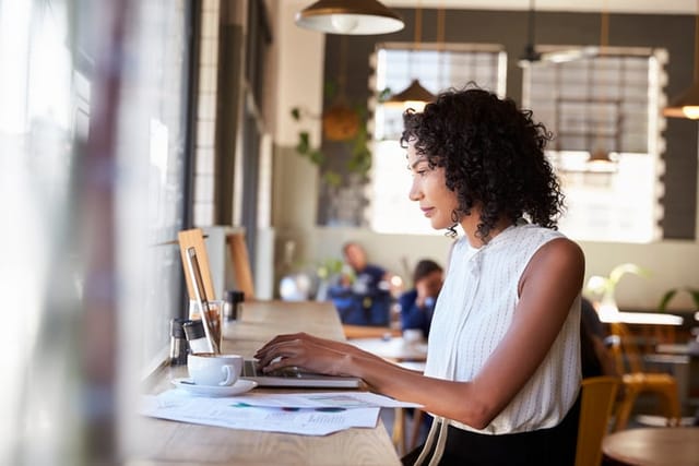 woman concentrating on work on laptop