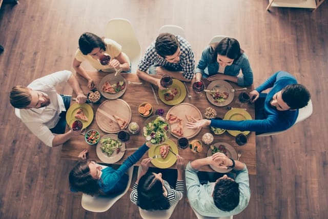 family having dinner around the table