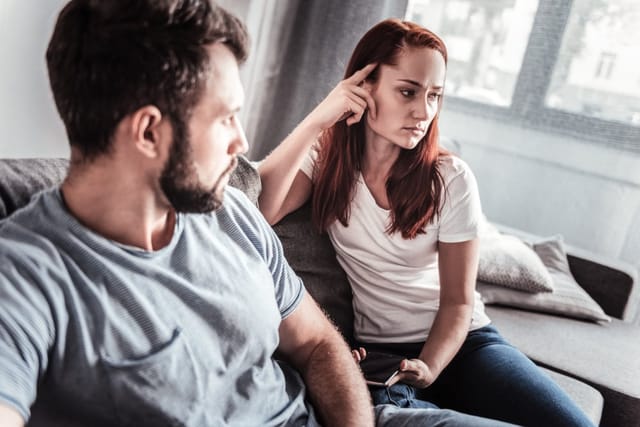 Man and woman deep in conversation.