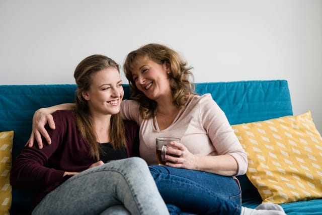 Mother and daughter chatting.