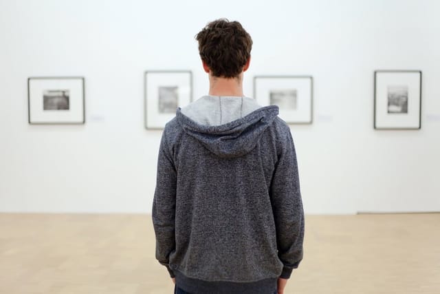 Man at a museum alone.
