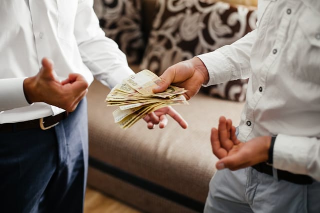 People counting money.