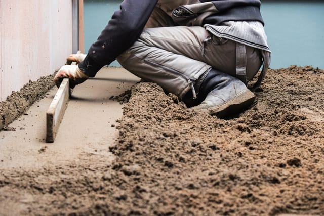 Man pouring a concrete slab