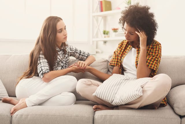Two women in a serious talk.
