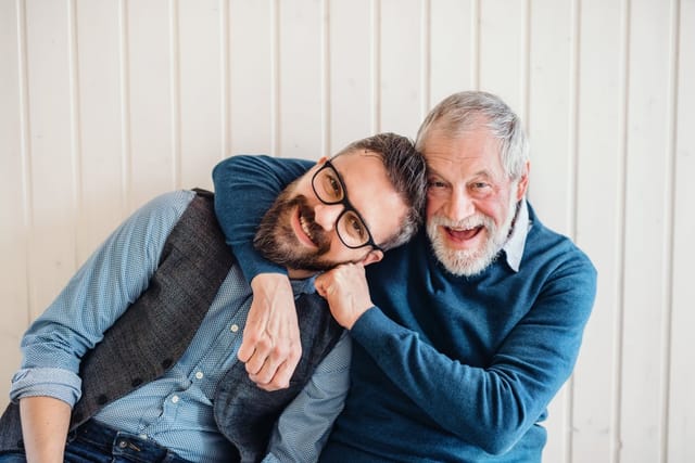 Father joking around with his son.