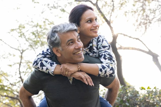 Happy couple on a walk outside.
