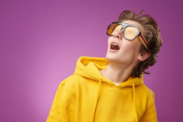 Young boy in sunglasses.