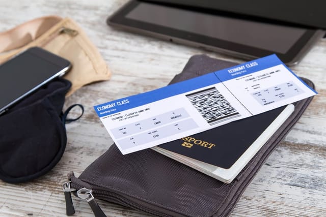 Airline ticket and passport.