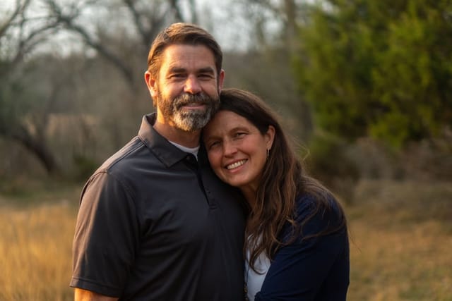 A happy couple on a walk outdoors.