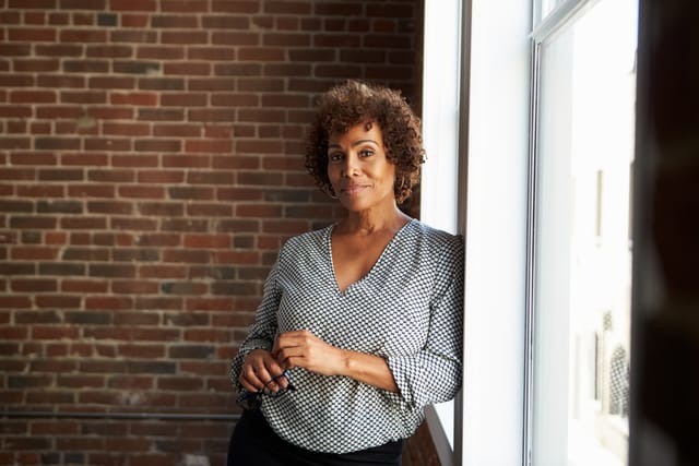 Woman standing in her office.